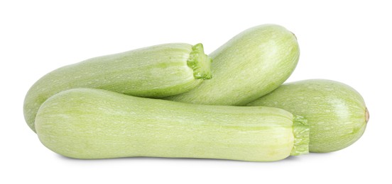 Photo of Many fresh ripe zucchinis isolated on white