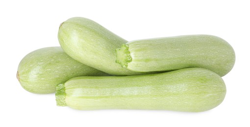 Photo of Many fresh ripe zucchinis isolated on white