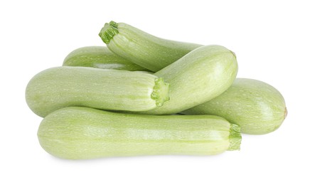 Photo of Many fresh ripe zucchinis isolated on white