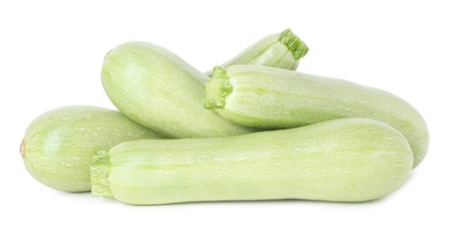 Photo of Many fresh ripe zucchinis isolated on white