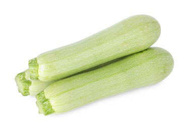 Photo of Many fresh ripe zucchinis isolated on white, above view