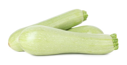 Photo of Many fresh ripe zucchinis isolated on white