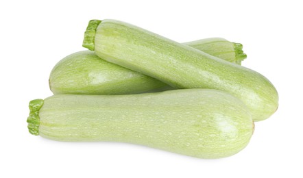 Photo of Many fresh ripe zucchinis isolated on white