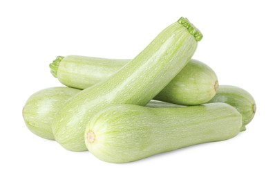 Photo of Many fresh ripe zucchinis isolated on white