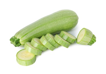 Photo of Fresh whole and cut zucchinis isolated on white