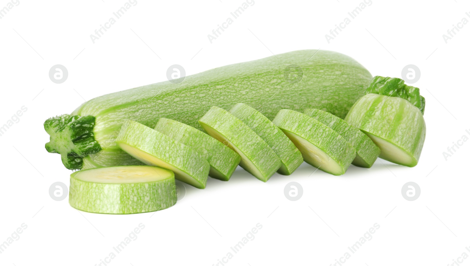 Photo of Fresh whole and cut zucchinis isolated on white