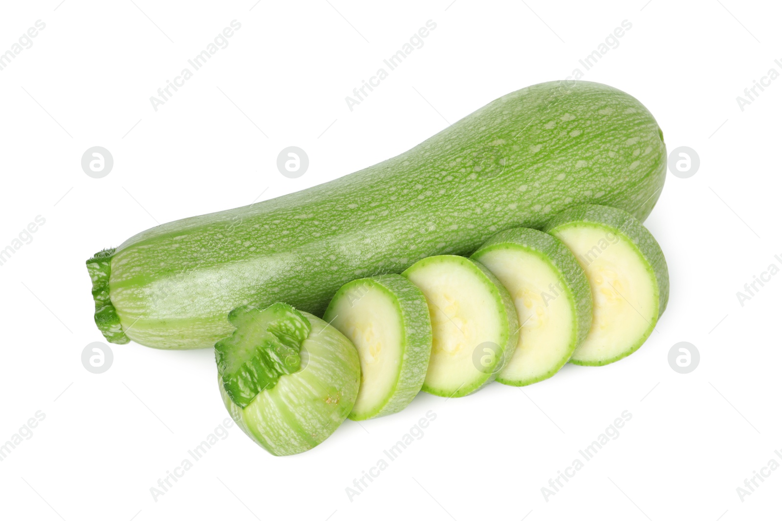 Photo of Fresh whole and cut zucchinis isolated on white, top view