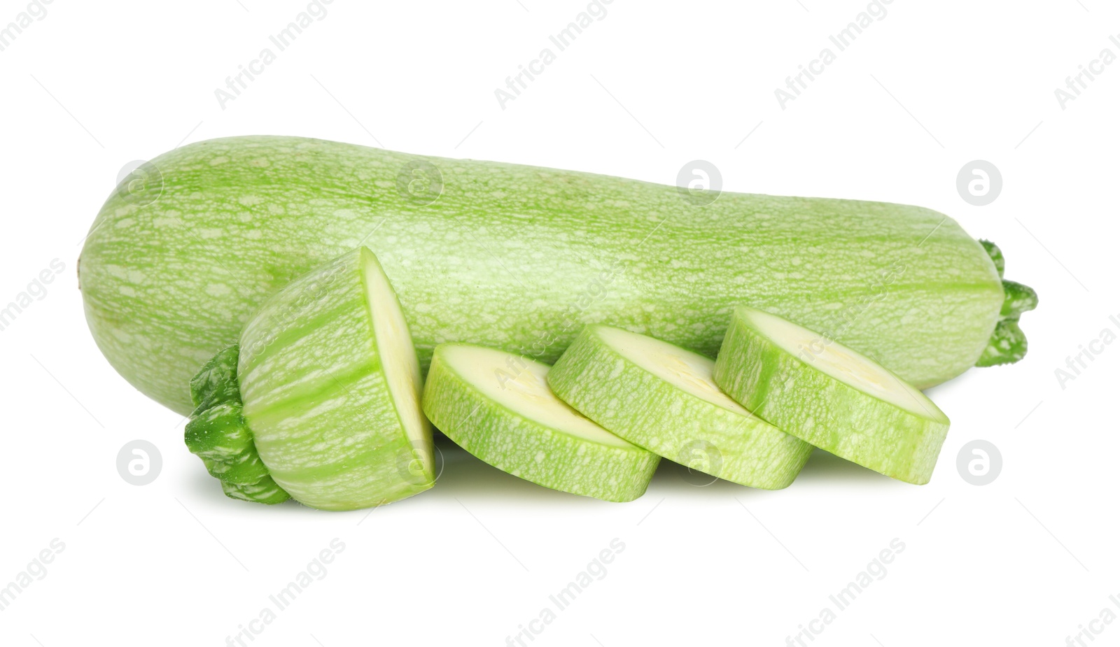 Photo of Fresh whole and cut zucchinis isolated on white