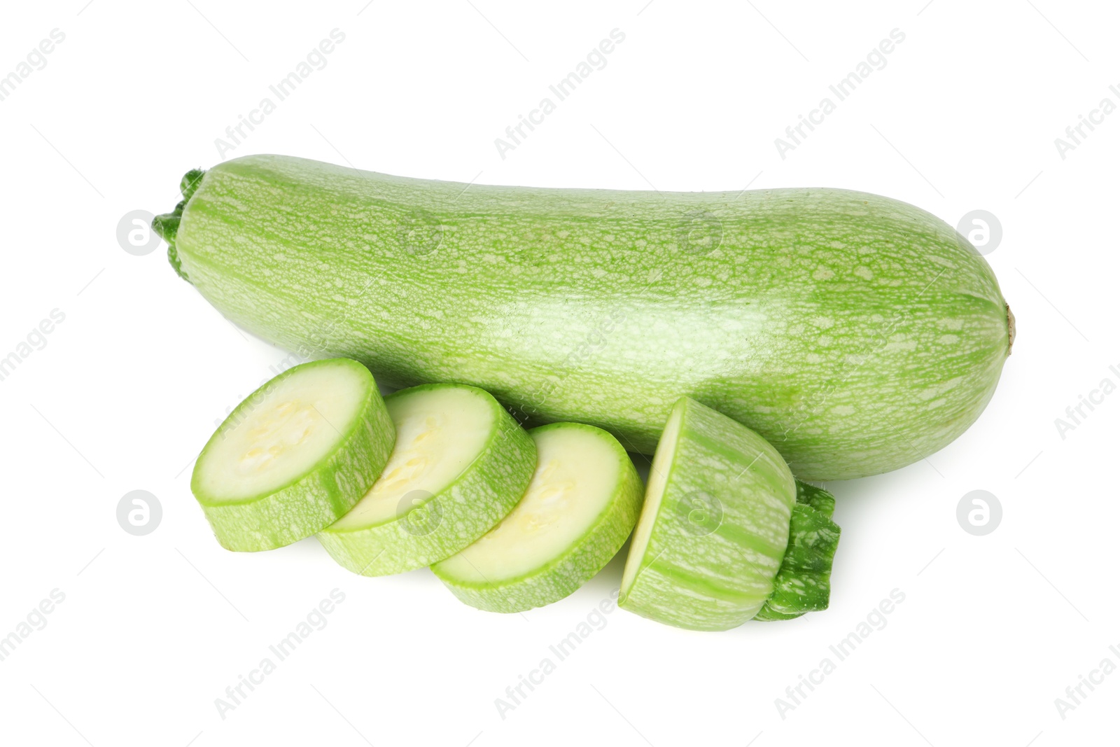 Photo of Fresh whole and cut zucchinis isolated on white, top view