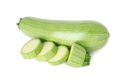 Photo of Fresh whole and cut zucchinis isolated on white, top view