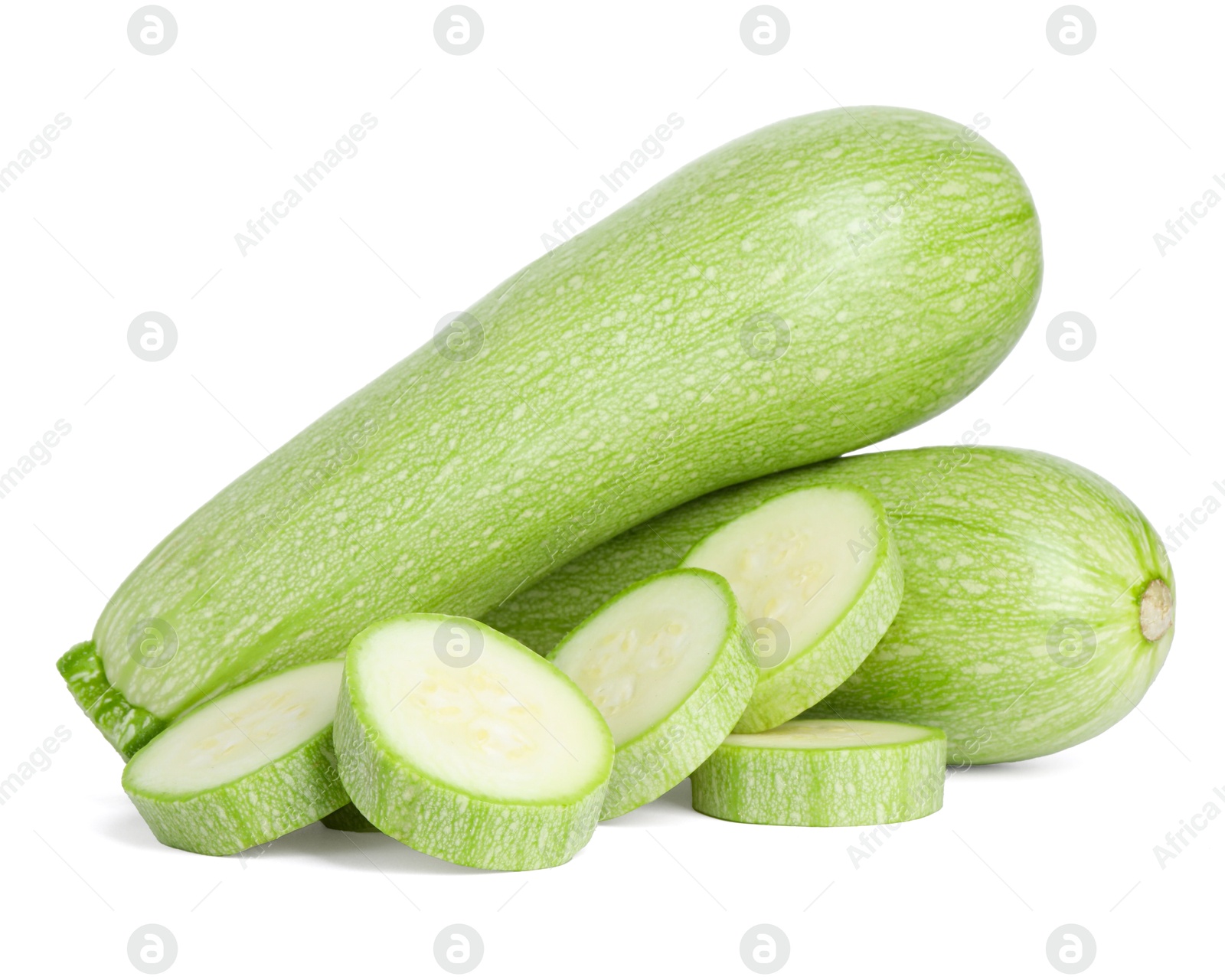 Photo of Fresh whole and cut zucchinis isolated on white