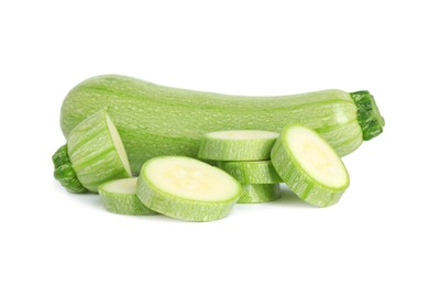 Photo of Fresh whole and cut zucchinis isolated on white