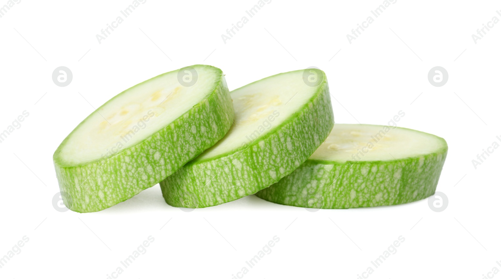 Photo of Pieces of fresh zucchini isolated on white