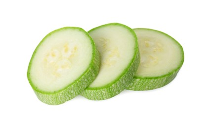 Photo of Pieces of fresh zucchini isolated on white