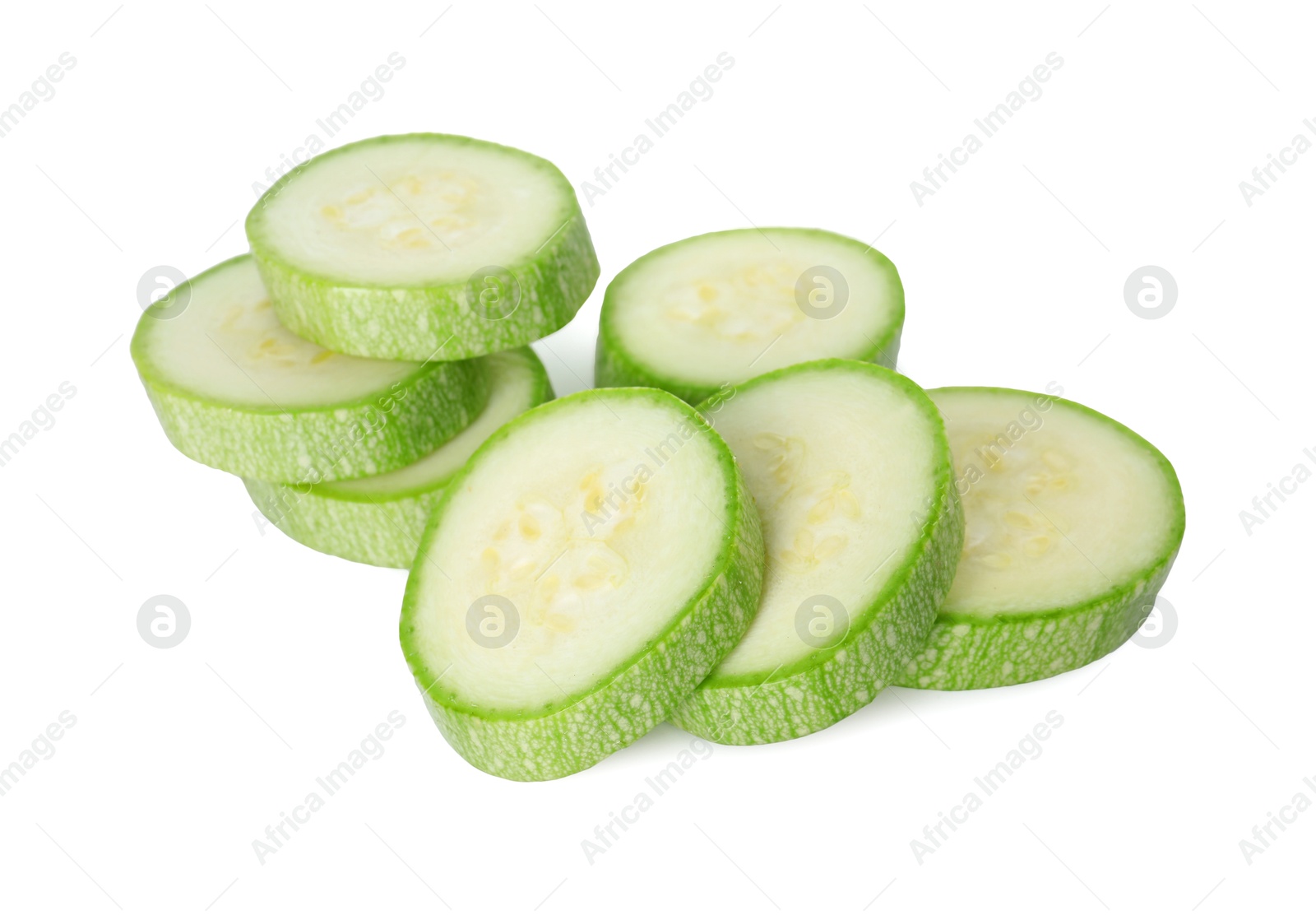 Photo of Pieces of fresh zucchini isolated on white