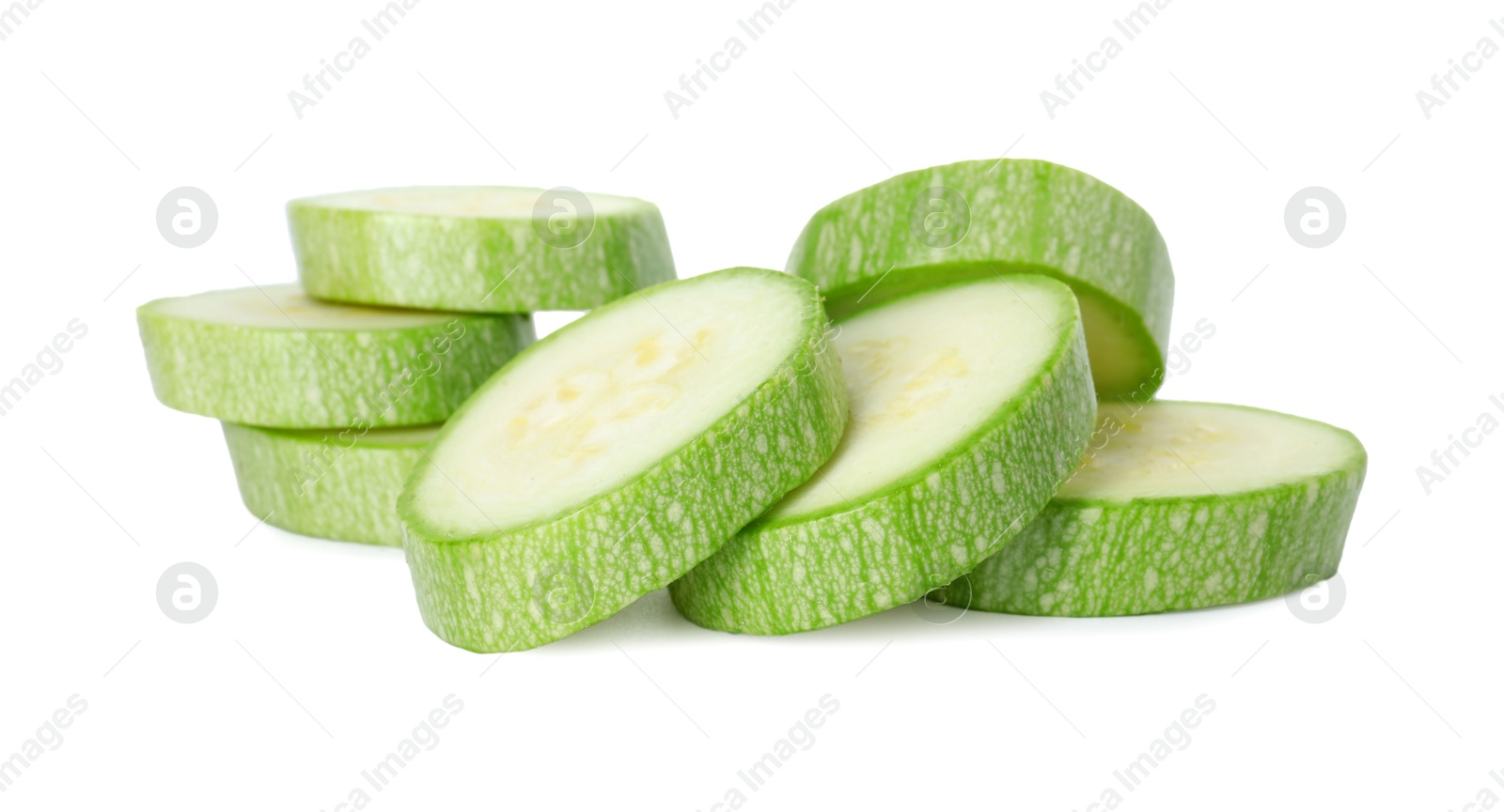 Photo of Pieces of fresh zucchini isolated on white