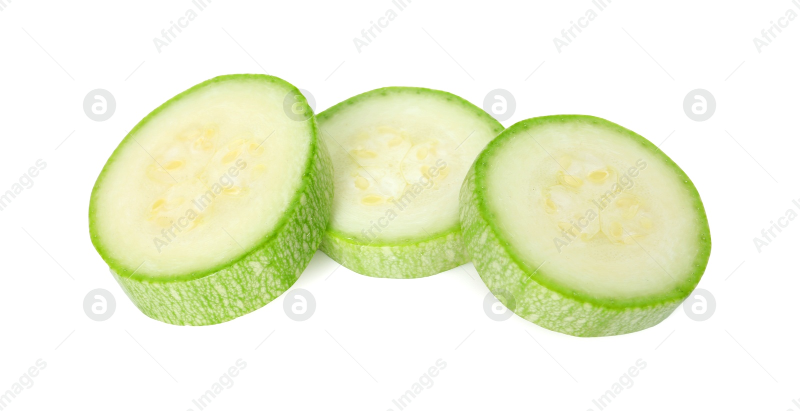 Photo of Pieces of fresh zucchini isolated on white