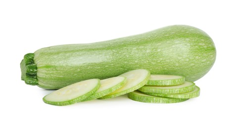 Photo of Fresh whole and cut zucchinis isolated on white