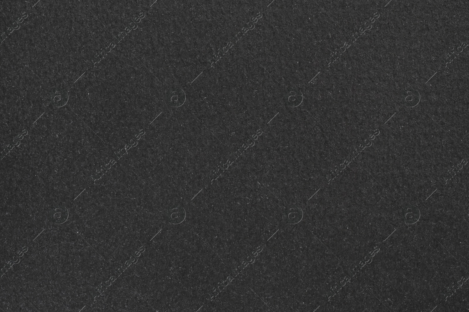 Photo of Texture of paper with dark gray ink as background, top view