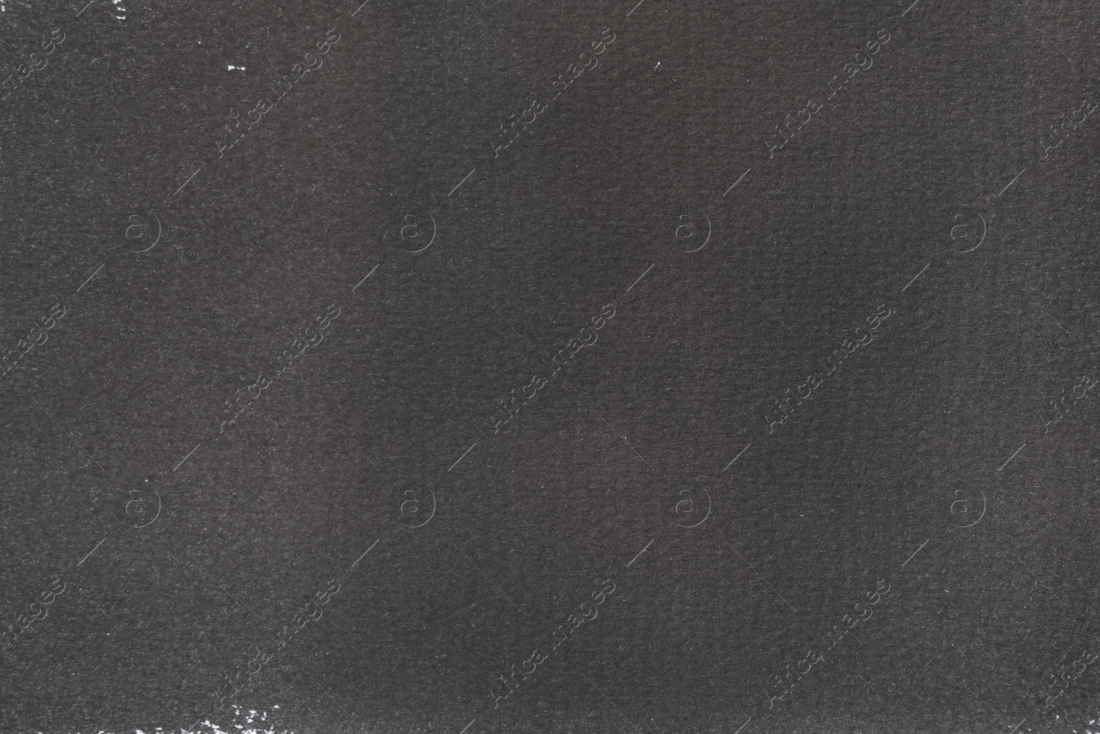 Photo of Texture of paper with dark gray ink as background, top view