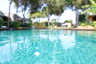 Photo of Blurred view of outdoor swimming pool at luxury resort