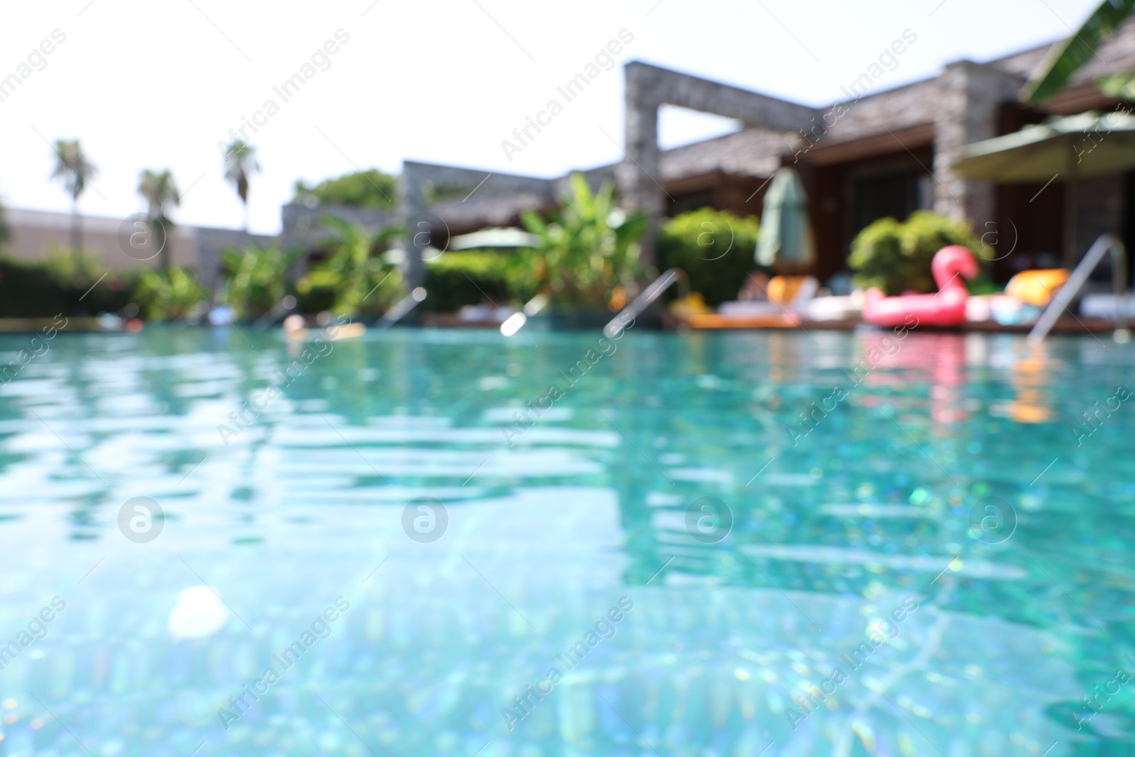 Photo of Blurred view of outdoor swimming pool at luxury resort