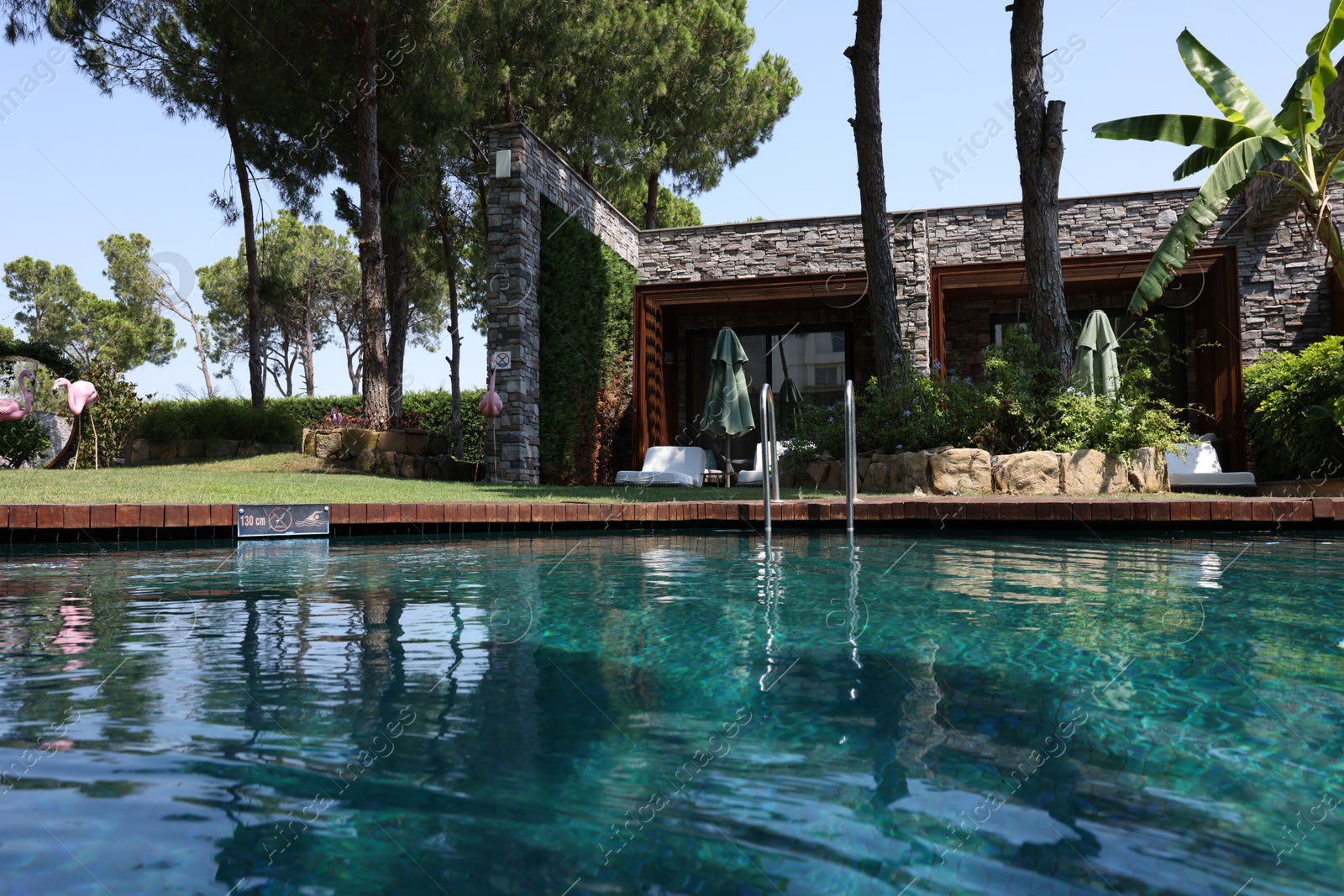 Photo of Outdoor swimming pool with clear water at luxury resort