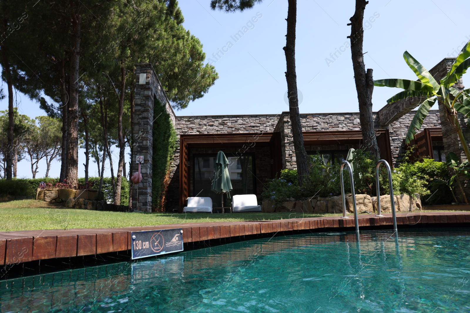 Photo of Outdoor swimming pool with clear water at luxury resort