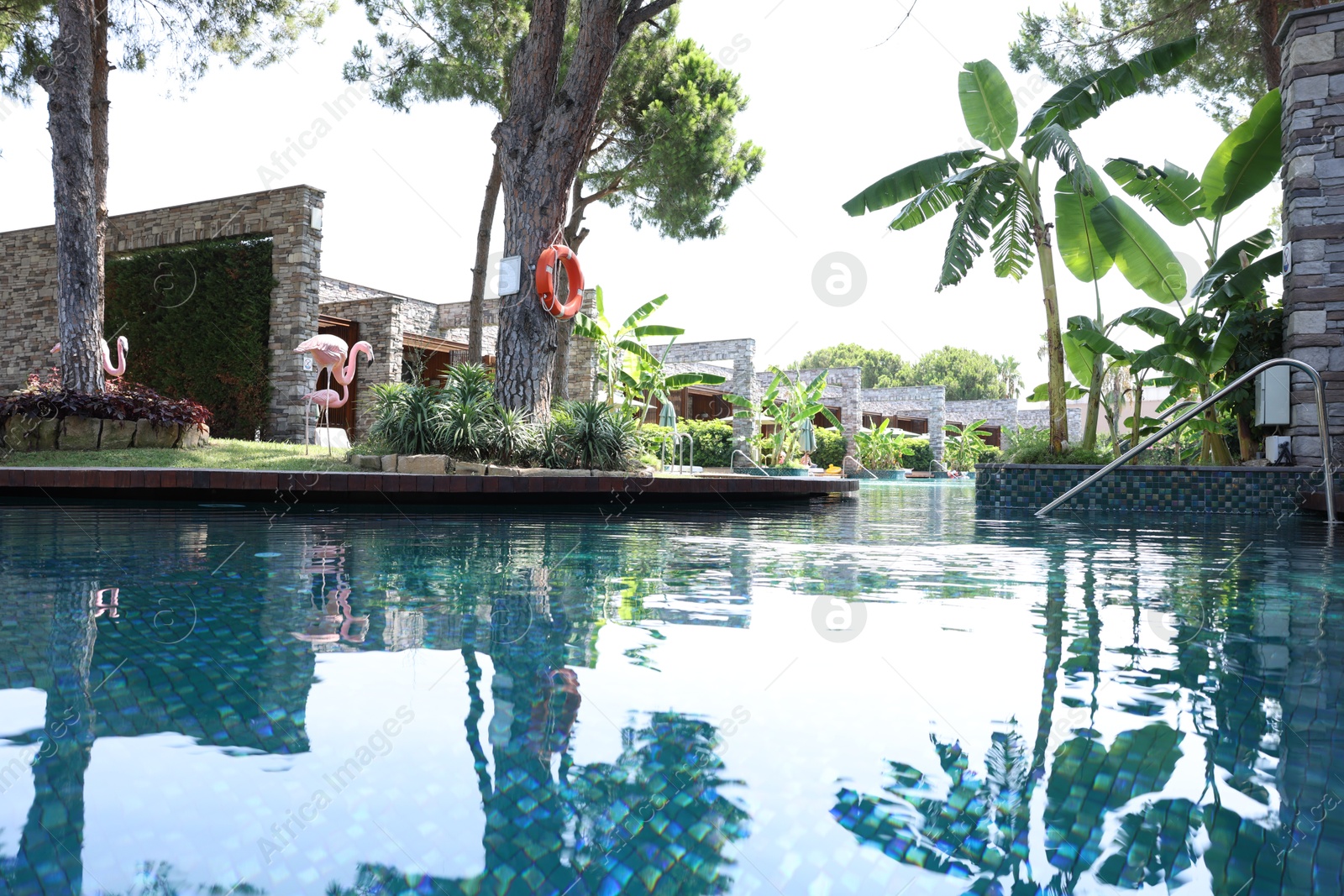 Photo of Outdoor swimming pool with clear water at luxury resort