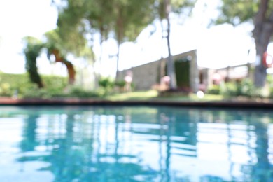 Photo of Blurred view of outdoor swimming pool at luxury resort