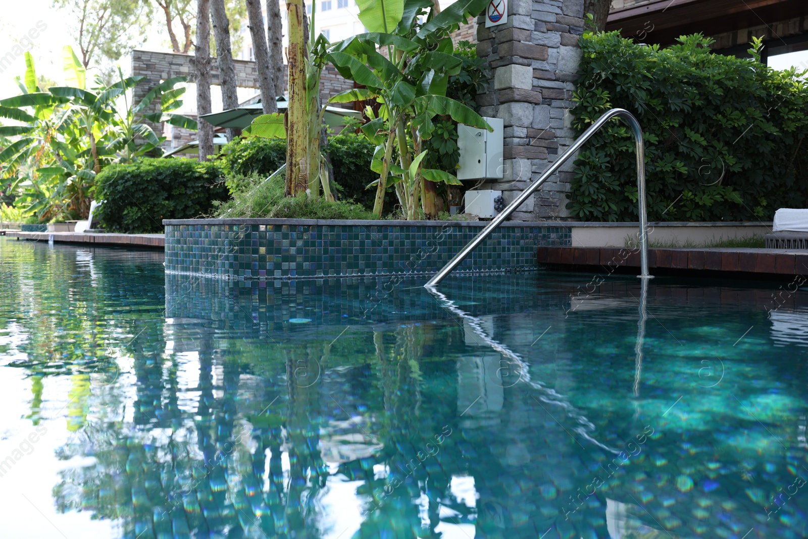 Photo of Outdoor swimming pool with clear water at luxury resort