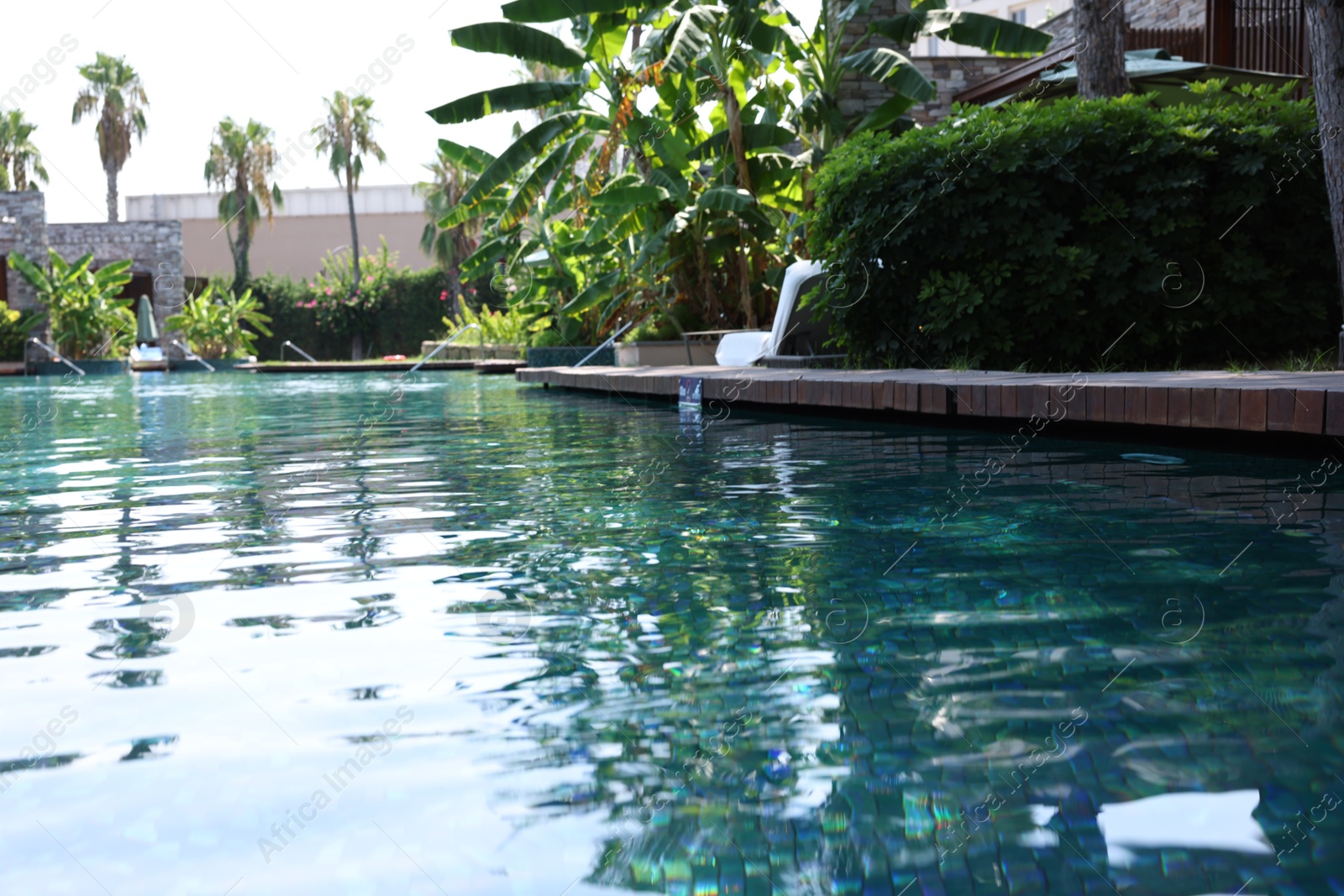 Photo of Outdoor swimming pool with clear water at luxury resort