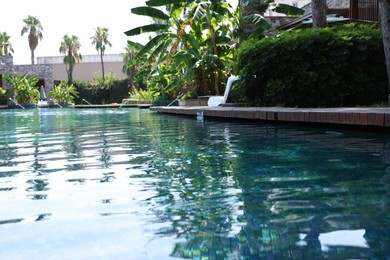 Outdoor swimming pool with clear water at luxury resort