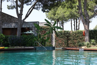 Outdoor swimming pool with clear water at luxury resort