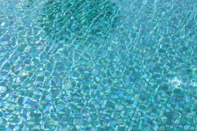 Clear water with ripples in outdoor swimming pool