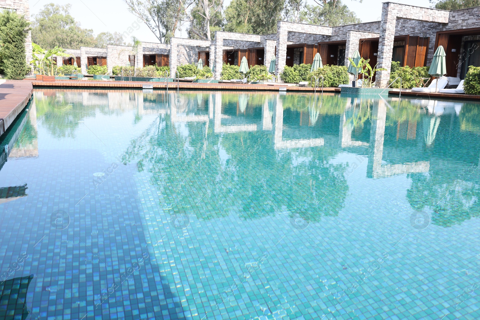 Photo of Outdoor swimming pool with clear water at luxury resort