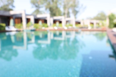 Blurred view of outdoor swimming pool at luxury resort