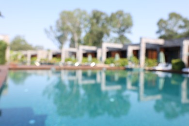 Blurred view of outdoor swimming pool at luxury resort