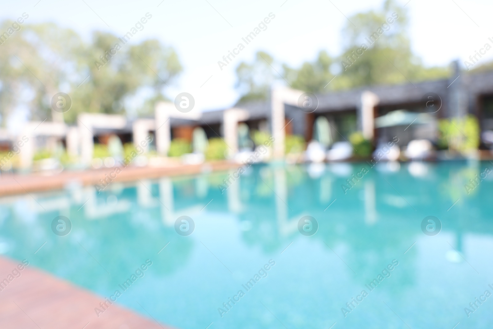 Photo of Blurred view of outdoor swimming pool at luxury resort