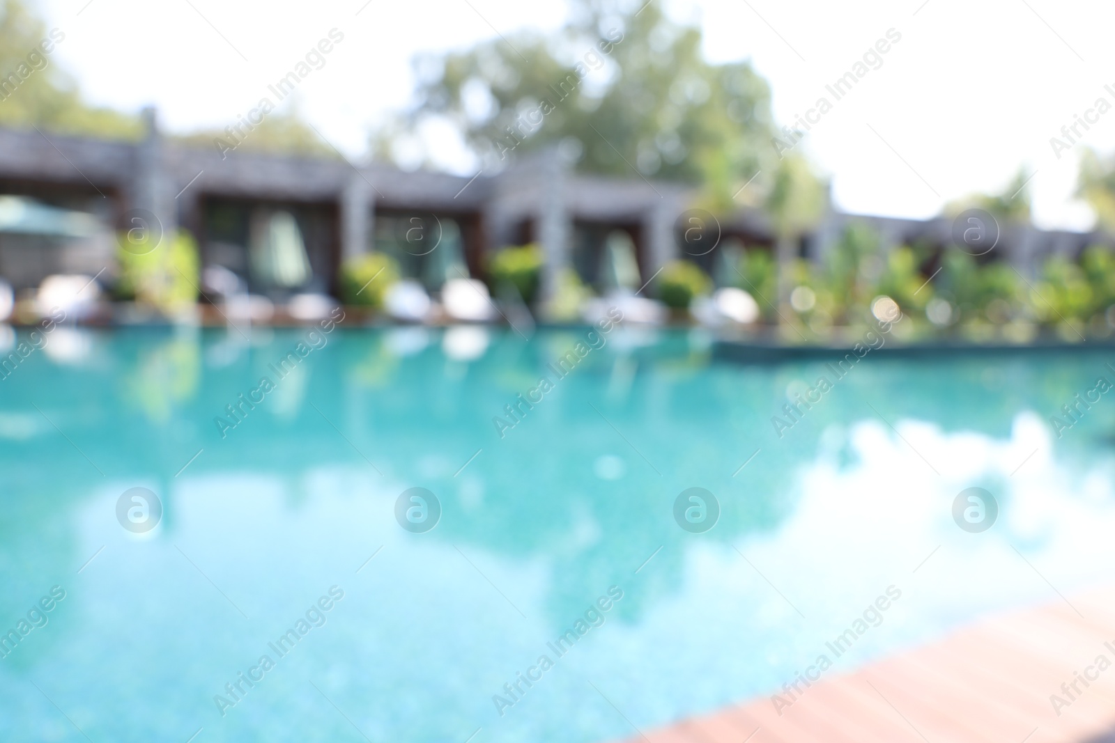 Photo of Blurred view of outdoor swimming pool at luxury resort