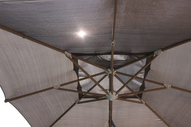 Photo of Open beach umbrella on sunny day, closeup