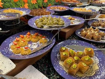 Photo of Different tasty desserts on table. Buffet service