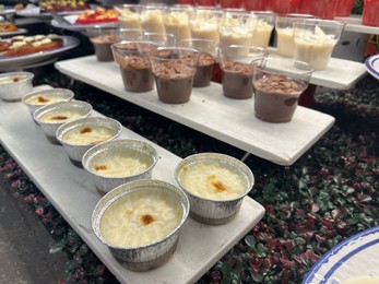 Photo of Different tasty desserts on table. Buffet service