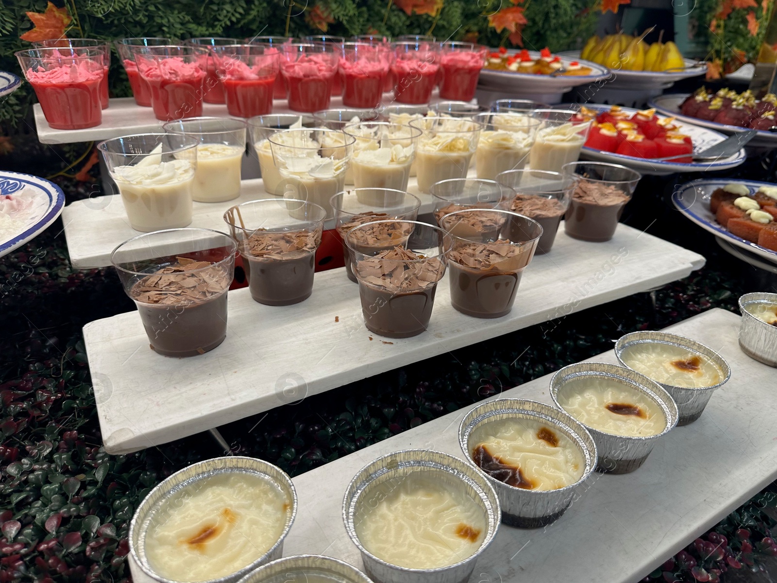 Photo of Different tasty desserts on table. Buffet service