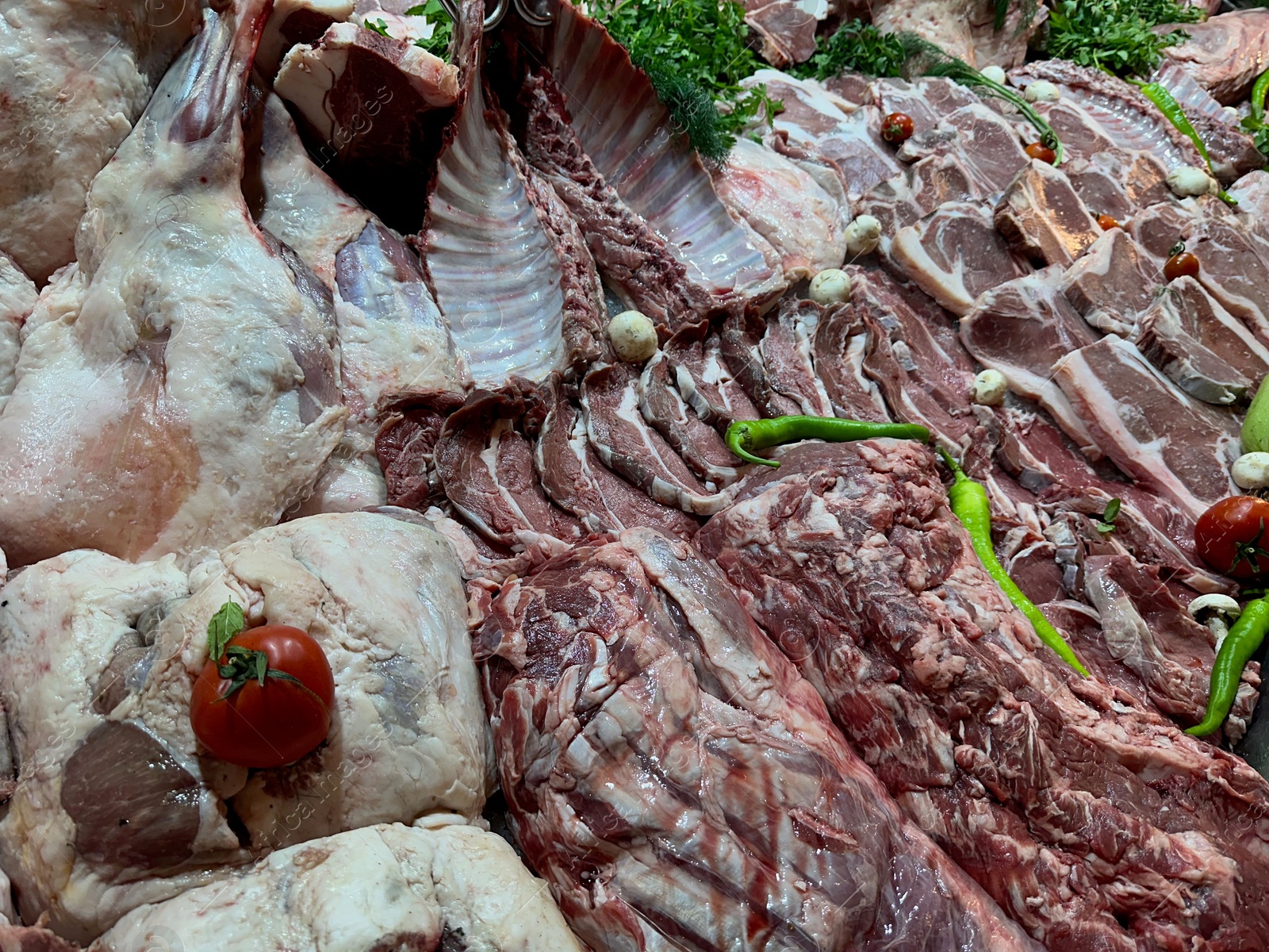 Photo of Closeup view of fresh cut raw meat and vegetables