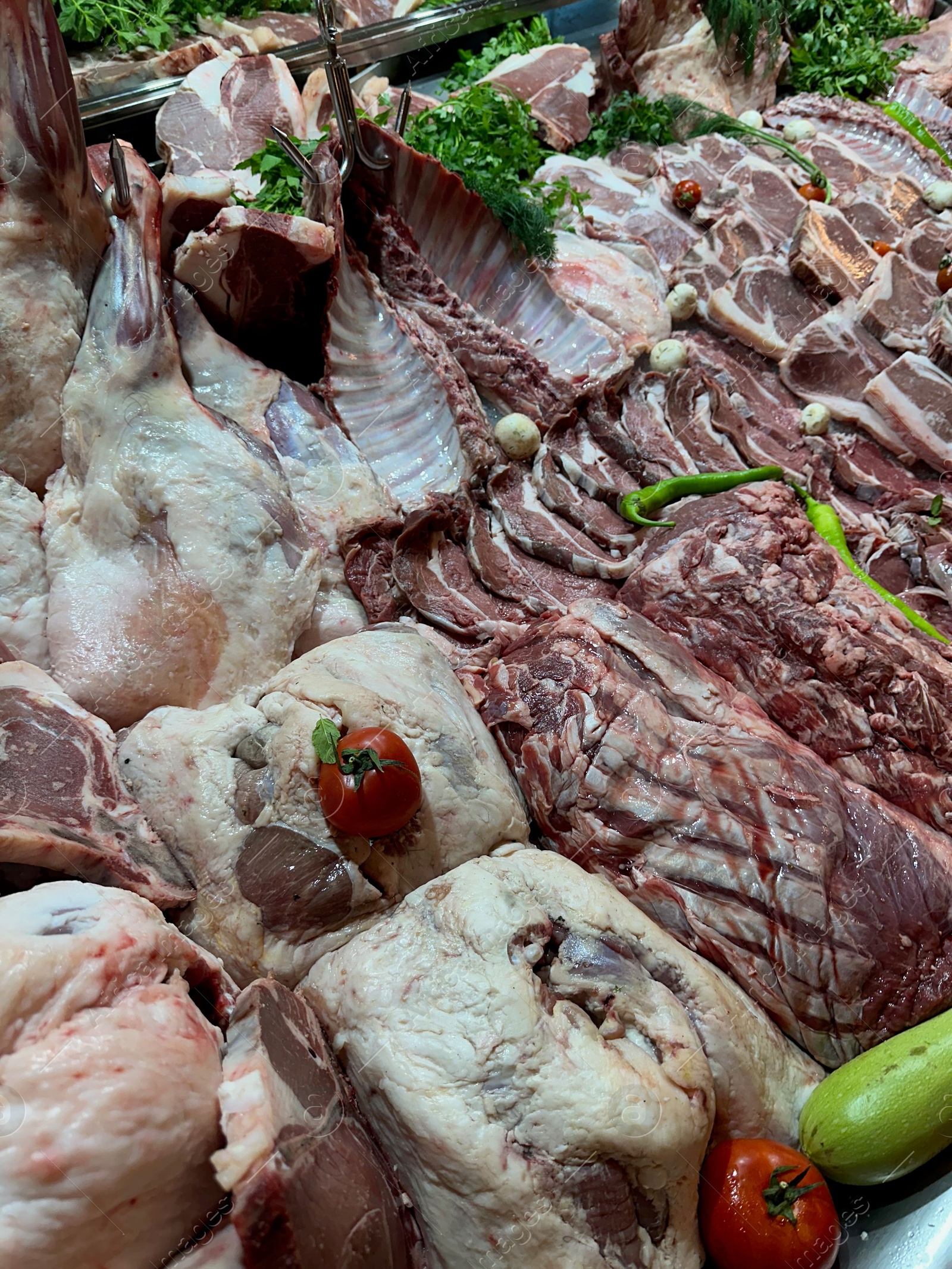 Photo of Closeup view of fresh cut raw meat and vegetables