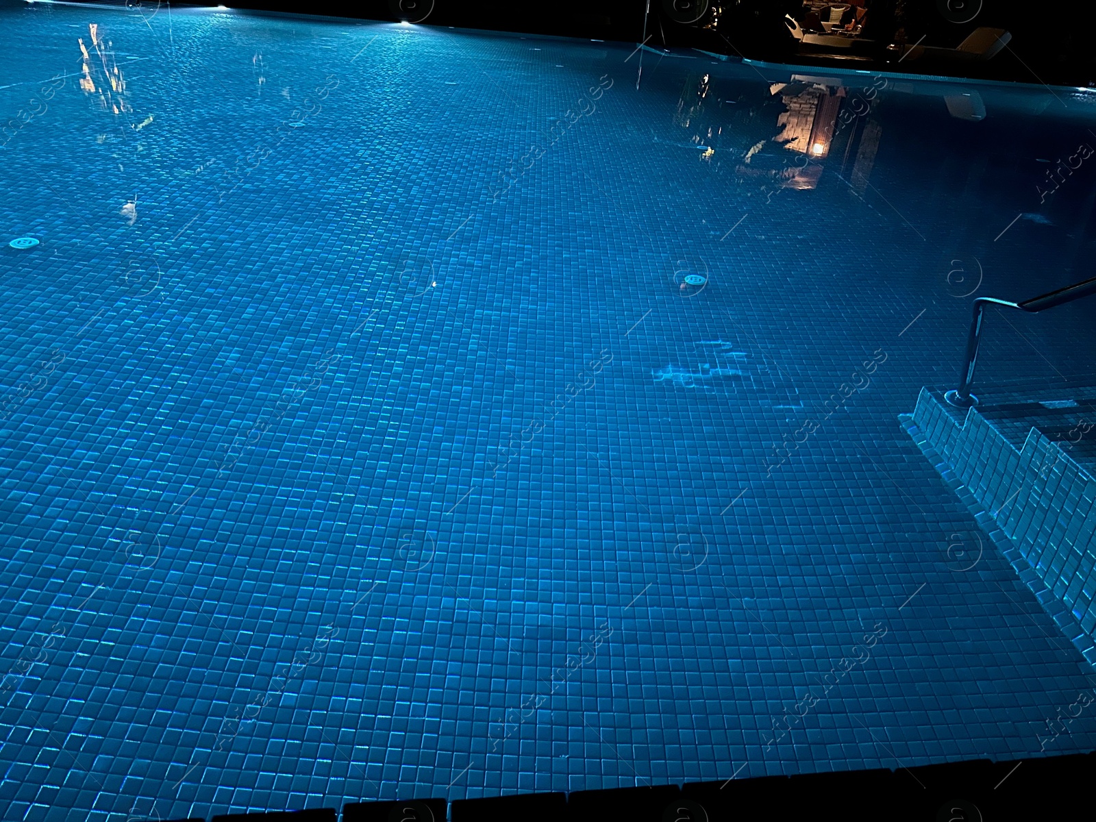 Photo of Beautiful view of swimming pool with clear water at night