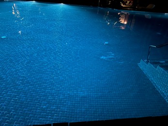 Beautiful view of swimming pool with clear water at night