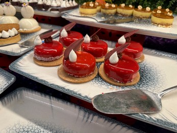 Photo of Different tasty desserts on table. Buffet service