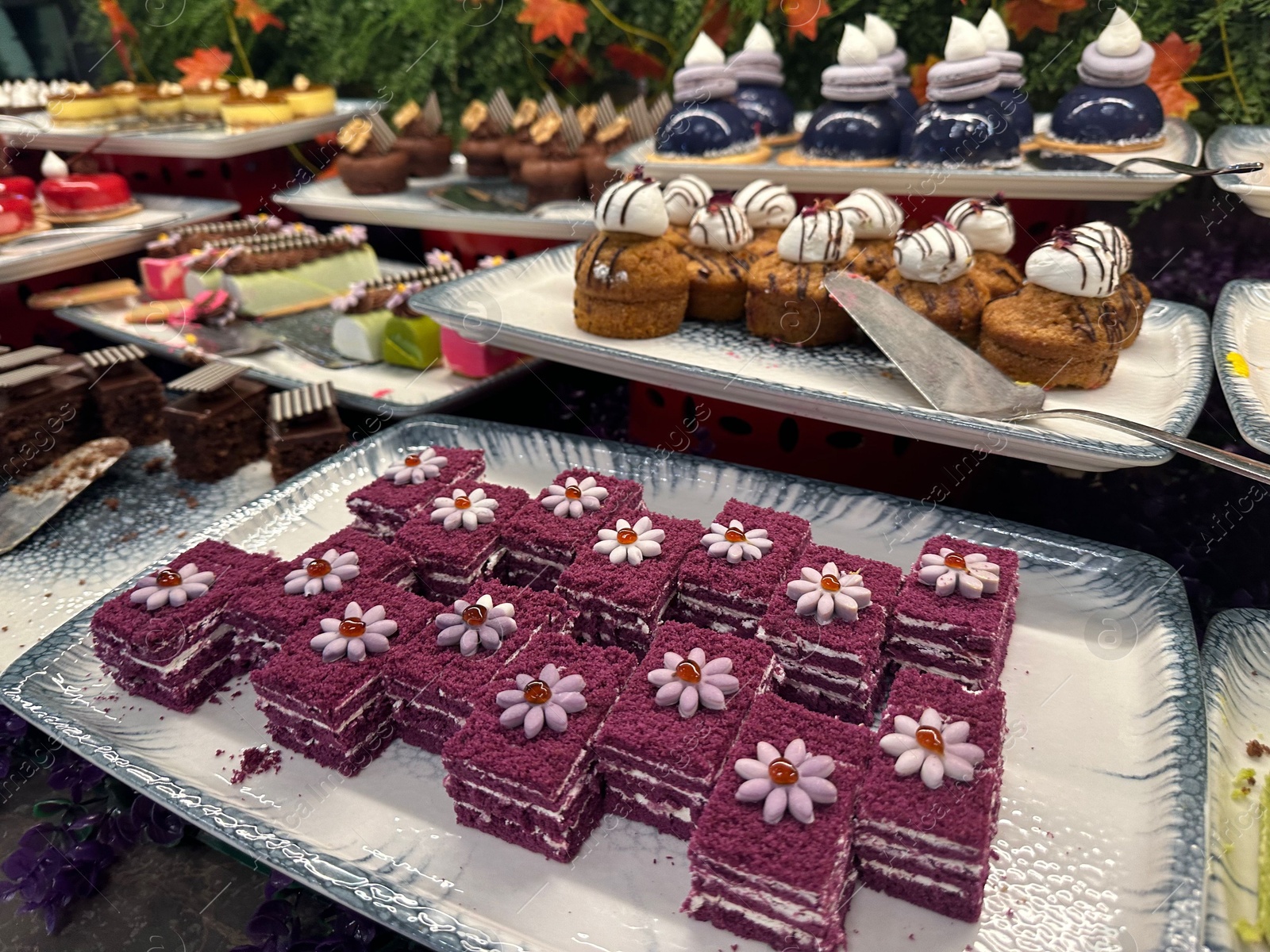 Photo of Different tasty desserts on table. Buffet service